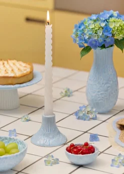 Blue candleholder with embossed hydrangeas
