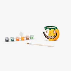 DIY pumpkin tealight holder with paint and brush
