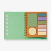 Green notebook with ballpoint pen and memos
