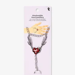 Silver hand jewellery with red heart